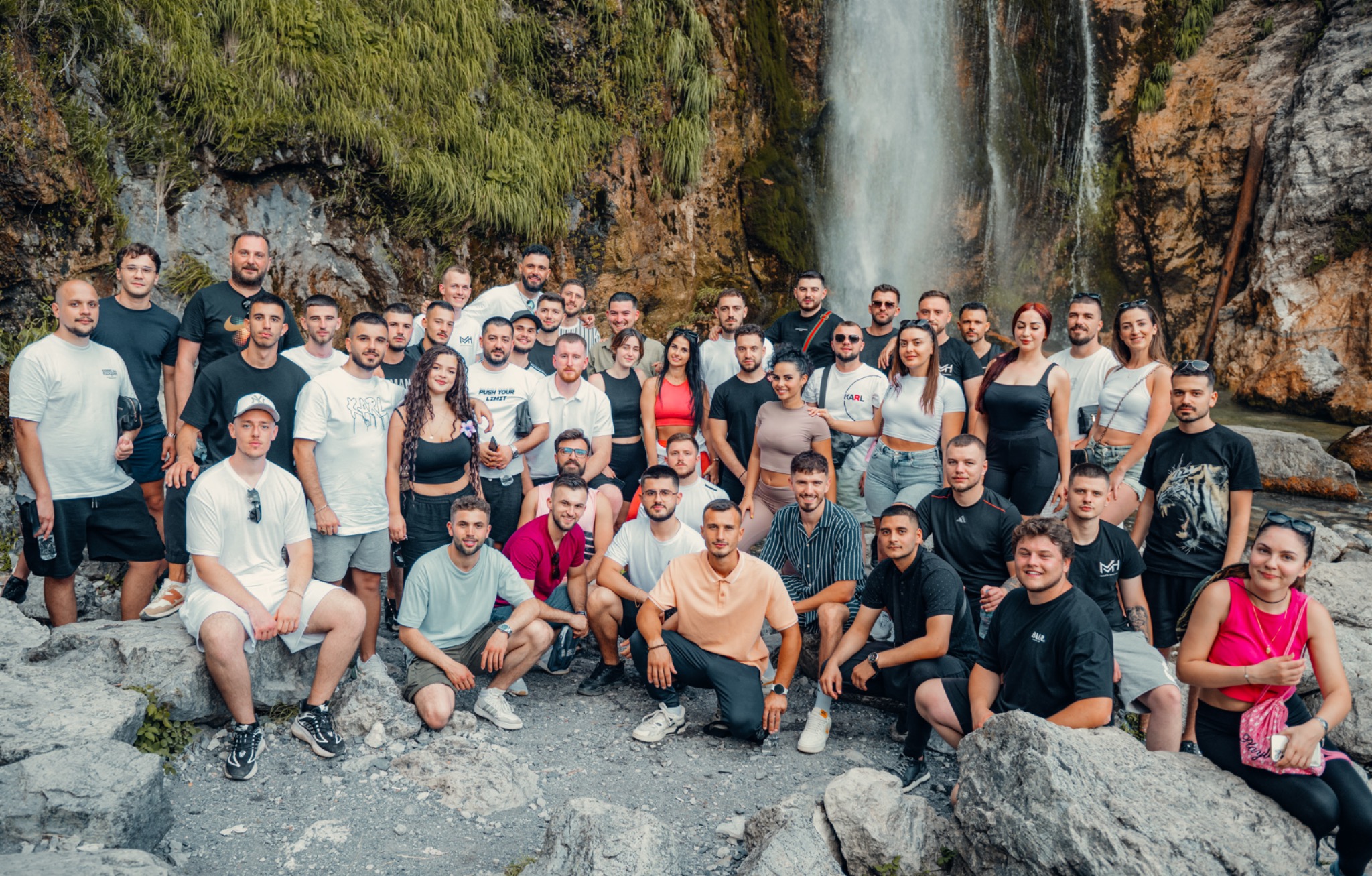 MiriFX academy community together beside a waterfall